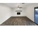 Living room with fireplace and wood-look floors at 610 W Medina Ave, Mesa, AZ 85210