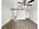 Main bedroom with ensuite bathroom and barn door at 610 W Medina Ave, Mesa, AZ 85210