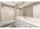 Bathroom with a shower/tub combo, white vanity, and mirror at 6526 W Briles Rd, Phoenix, AZ 85083