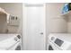 Laundry room with washer, dryer, and storage at 7008 W Mitchell Dr, Phoenix, AZ 85033