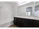 Bathroom with double vanity and bathtub at 7813 W Palm Ln, Phoenix, AZ 85035