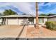 Light brick exterior with two-car garage and courtyard at 7950 E Keats Ave # 156, Mesa, AZ 85209