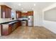 Modern kitchen with dark wood cabinets and stainless steel appliances at 804 W Dana Dr, San Tan Valley, AZ 85143