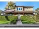 Two-story house with solar panels, landscaped yard, and a charming facade at 90 W Cottage Ln, Tempe, AZ 85282