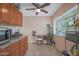 Bright kitchen with granite counters and wood cabinets at 10211 W Royal Oak Rd, Sun City, AZ 85351