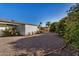 Spacious backyard with gravel and citrus trees at 14228 N Sierra Dawn Way, Sun City, AZ 85351