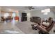 Spacious living room featuring leather furniture and a fireplace at 14823 N Bolivar Dr, Sun City, AZ 85351