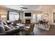 Living room with dark brown sofa, fireplace, and dining table at 15095 N Thompson Peak Pkwy # 2114, Scottsdale, AZ 85260