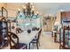 Elegant dining room with a large chandelier and mountain views at 15868 E Ponderosa Dr, Fountain Hills, AZ 85268