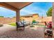 Covered patio with outdoor furniture and a vibrant rug at 15912 W Marconi Ave, Surprise, AZ 85374