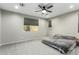 Spacious bedroom with grey carpet and ceiling fan at 17826 W Straight Arrow Ln, Surprise, AZ 85387