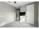 Bedroom with grey carpet and double door closet at 17826 W Straight Arrow Ln, Surprise, AZ 85387