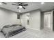 Main bedroom with ensuite bathroom and grey carpet at 17826 W Straight Arrow Ln, Surprise, AZ 85387