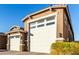 Houses with a three-car garage and brick driveway at 17826 W Straight Arrow Ln, Surprise, AZ 85387