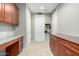 Inviting hallway with built-in cabinetry and storage at 17826 W Straight Arrow Ln, Surprise, AZ 85387