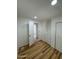 Charming bedroom with wood-look floors and access to another room at 201 S Greenfield Rd # 333, Mesa, AZ 85206