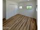 Spacious bedroom featuring light wood flooring and built-in closet at 201 S Greenfield Rd # 333, Mesa, AZ 85206