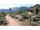 Desert hiking trail with mountain views and trail markers at 20241 W San Miguel Ave, Litchfield Park, AZ 85340