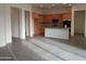 Open concept kitchen with island and gray tile flooring at 21025 E Camina Buena Vis, Queen Creek, AZ 85142