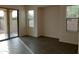 Bright living room with sliding glass door leading to backyard at 21025 E Camina Buena Vis, Queen Creek, AZ 85142