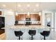 Modern kitchen with granite island and breakfast bar at 21686 N 259Th Dr, Buckeye, AZ 85396