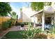 Private backyard oasis with covered patio, fire pit, and lush landscaping at 2339 E Evans Dr, Phoenix, AZ 85022