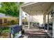 Relaxing patio with seating area, string lights, and a grassy backyard at 2339 E Evans Dr, Phoenix, AZ 85022