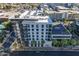 Modern building with city street and palm trees at 3131 N Central Ave # 5022, Phoenix, AZ 85012