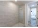 Modern bathroom with a walk-in shower and white cabinets at 3131 N Central Ave # 5022, Phoenix, AZ 85012