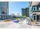 Landscaped community garden with a blue stone pathway at 3131 N Central Ave # 5022, Phoenix, AZ 85012