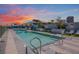 Community pool with lounge chairs and sunset views at 3131 N Central Ave # 5022, Phoenix, AZ 85012
