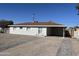 Newly renovated single-story home with a landscaped front yard and driveway at 3148 W Solano N Dr, Phoenix, AZ 85017