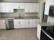 Renovated kitchen featuring white cabinets and stainless steel appliances at 3148 W Solano N Dr, Phoenix, AZ 85017