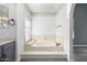 Bathroom featuring a built-in bathtub and neutral color scheme at 3315 E Hampton Ave, Mesa, AZ 85204