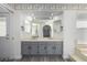 Bathroom with dual vanity, gray cabinets, and updated fixtures at 3315 E Hampton Ave, Mesa, AZ 85204