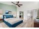 Main bedroom with blue bed and access to other rooms at 3315 E Hampton Ave, Mesa, AZ 85204