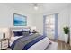 Bedroom with a calming blue and white color scheme and arched window at 3315 E Hampton Ave, Mesa, AZ 85204