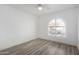 Well-lit bedroom with wood-look floors and arched window at 3315 E Hampton Ave, Mesa, AZ 85204