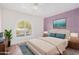 Bright bedroom with a large window, hardwood floors, and neutral color palette at 3315 E Hampton Ave, Mesa, AZ 85204