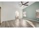 Bright bedroom with wood-look floors and ceiling fan at 3315 E Hampton Ave, Mesa, AZ 85204