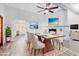 Bright dining room with modern table and chairs, and a view of the kitchen at 3315 E Hampton Ave, Mesa, AZ 85204