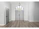 Bright entryway with gray double doors and wood-look floors at 3315 E Hampton Ave, Mesa, AZ 85204