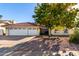 Single-story house with a two-car garage and desert landscaping at 3315 E Hampton Ave, Mesa, AZ 85204