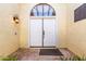 White double front doors with arched window and light fixture at 3315 E Hampton Ave, Mesa, AZ 85204