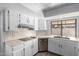 Kitchen with white cabinets, stainless steel appliances, and tile countertops at 3315 E Hampton Ave, Mesa, AZ 85204
