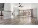 Open living room with brick fireplace and wood-look floors at 3315 E Hampton Ave, Mesa, AZ 85204