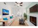 Living room with fireplace, neutral palette, and ample natural light at 3315 E Hampton Ave, Mesa, AZ 85204