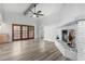 Living room features hardwood floors, fireplace and access to backyard at 3315 E Hampton Ave, Mesa, AZ 85204