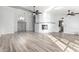 Living room with a corner fireplace and wood-look floors at 3315 E Hampton Ave, Mesa, AZ 85204