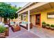 Spacious patio with comfortable seating and a citrus tree at 3315 E Hampton Ave, Mesa, AZ 85204